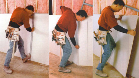 man cutting drywall