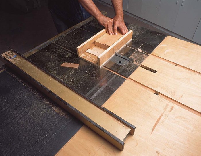 Shop-made sled makes cutting shims fast and safe.