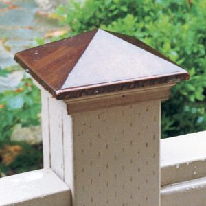Quick fix for a bad problem. To protect vulnerable end grain, the author covers the tops of 4x4 posts with ready-made copper caps. 