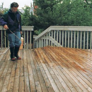 Instant make-over. After the cleaning process has left these old deck boards looking their age, an oxalic-acid based wood brightener quickly restores their youthful sparkle. The brightener is allowed to stand for 20 minutes, then is rinsed off with the pressure washer.