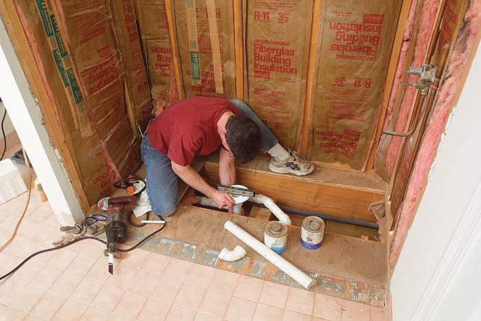 After I open the subfloor, the plumber can reroute the drain and vent to the new position.