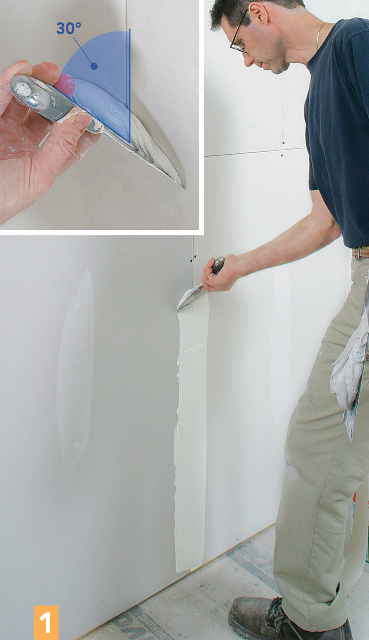 spreading drywall compound