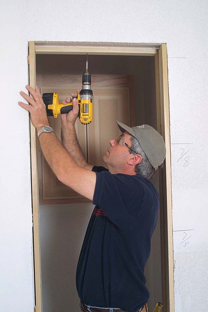 Install head jambs with screws so that jambs can be removed to access the roller-adjustment mechanism.