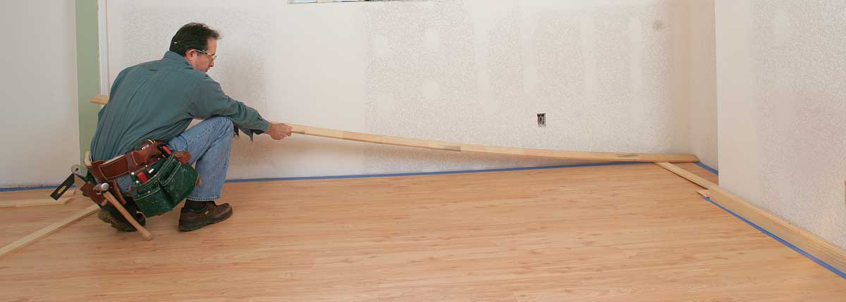 Distribute the cut pieces. Place the lengths of baseboard around the room near where they are going to be installed.