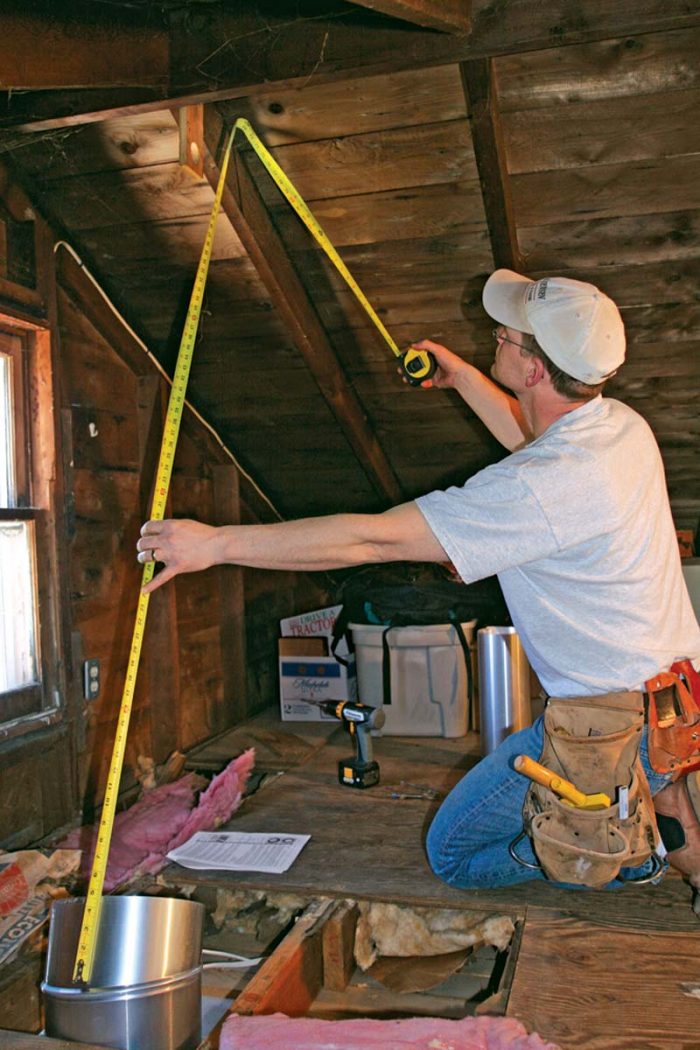 Clear away the insulation and deal with any obstructions like wiring or ductwork.