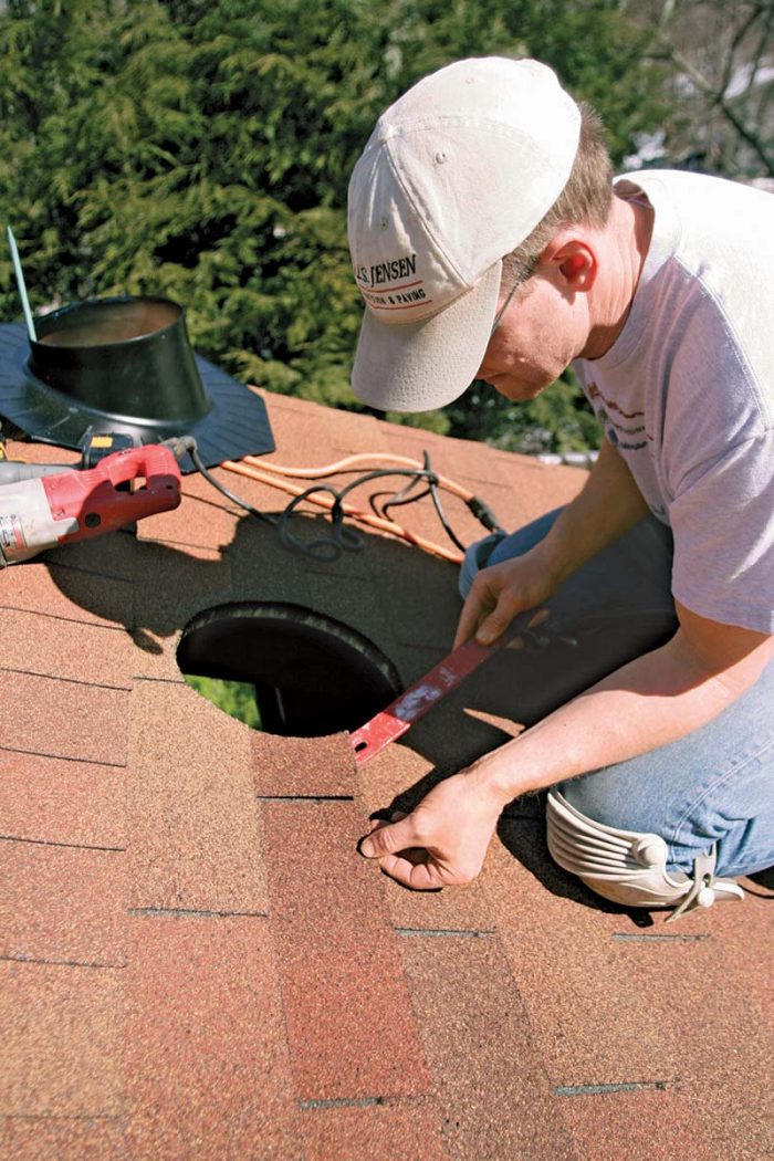 After the hole is cut, carefully loosen the shingles, and remove any nails that are in the way.