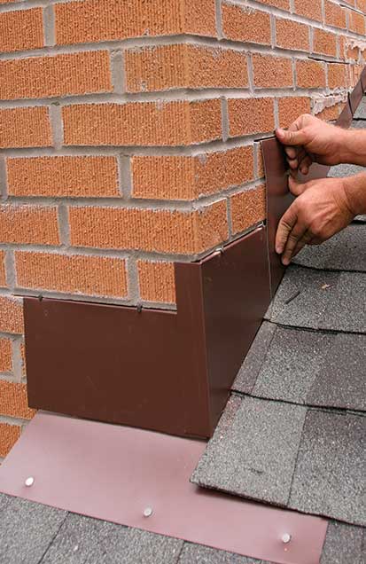 5. Counterflashing covers step flashing. The front piece covers the chimney’s apron flashing, and the bottom corner piece folds around the face of the chimney. Successive pieces overlap each other. 