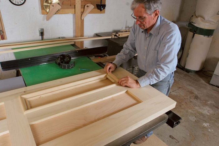 Rabbeted panel moldings are available, but stock molding from the local lumberyard or home center can be rabbeted on the tablesaw to fit the frame-and-panel door.