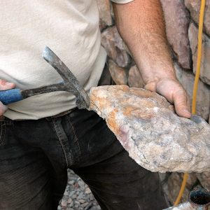 handle small corners of the manufactured stone with a brick hammer