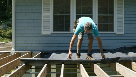 roll out the EPDM for the deck drainage system