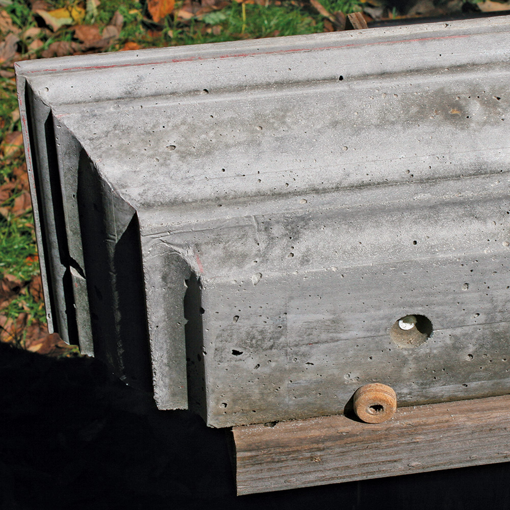 concrete mantel with holes for screws