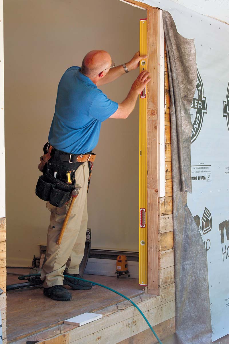Use a 6-ft. level to check the door opening for plumb and the rough sill for level.
