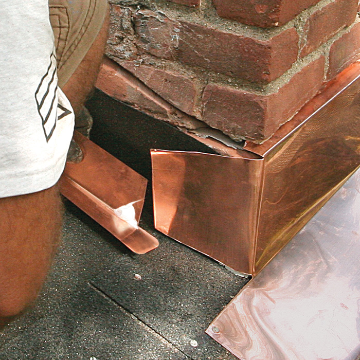 Trim the vertical leg on the first piece of step flashing