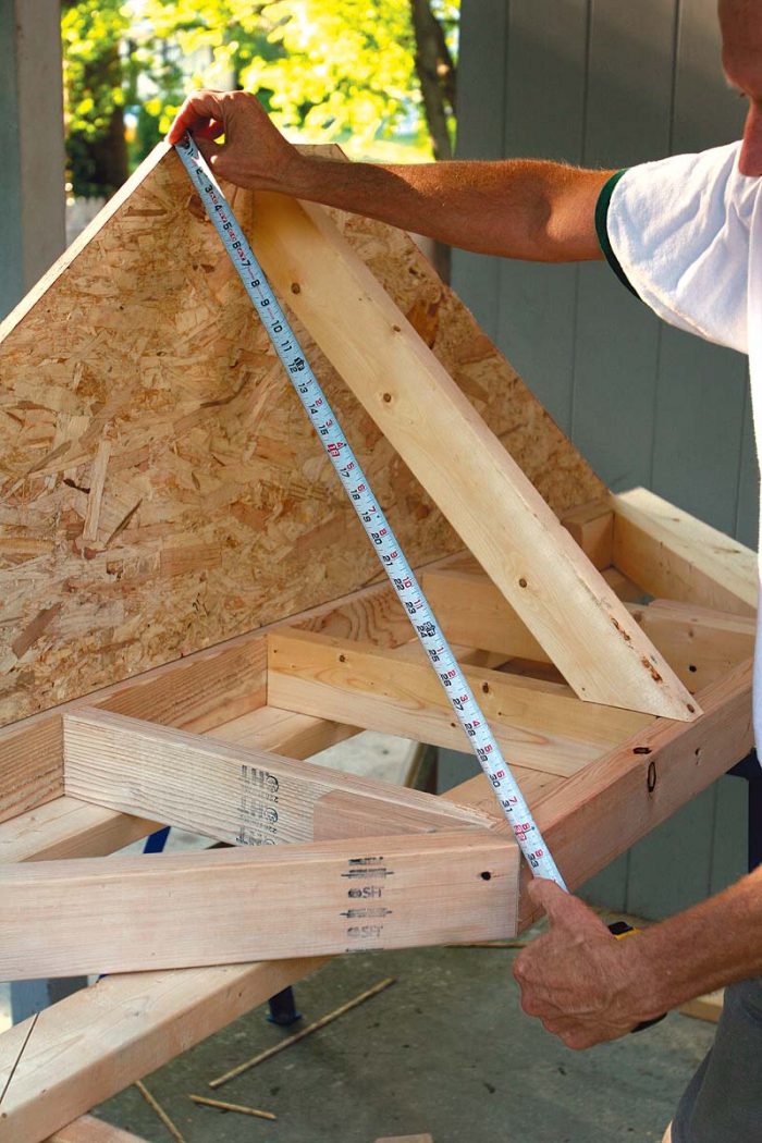 Measure the hips. The hip rafters run from the top corners of the rafter nailer to the outside corners of the subfascia.