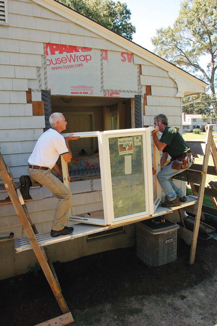 two men Installing The Window