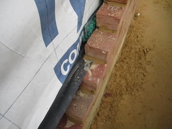Brick with Tyvek CommercialWrap & a Mortar Net at the base