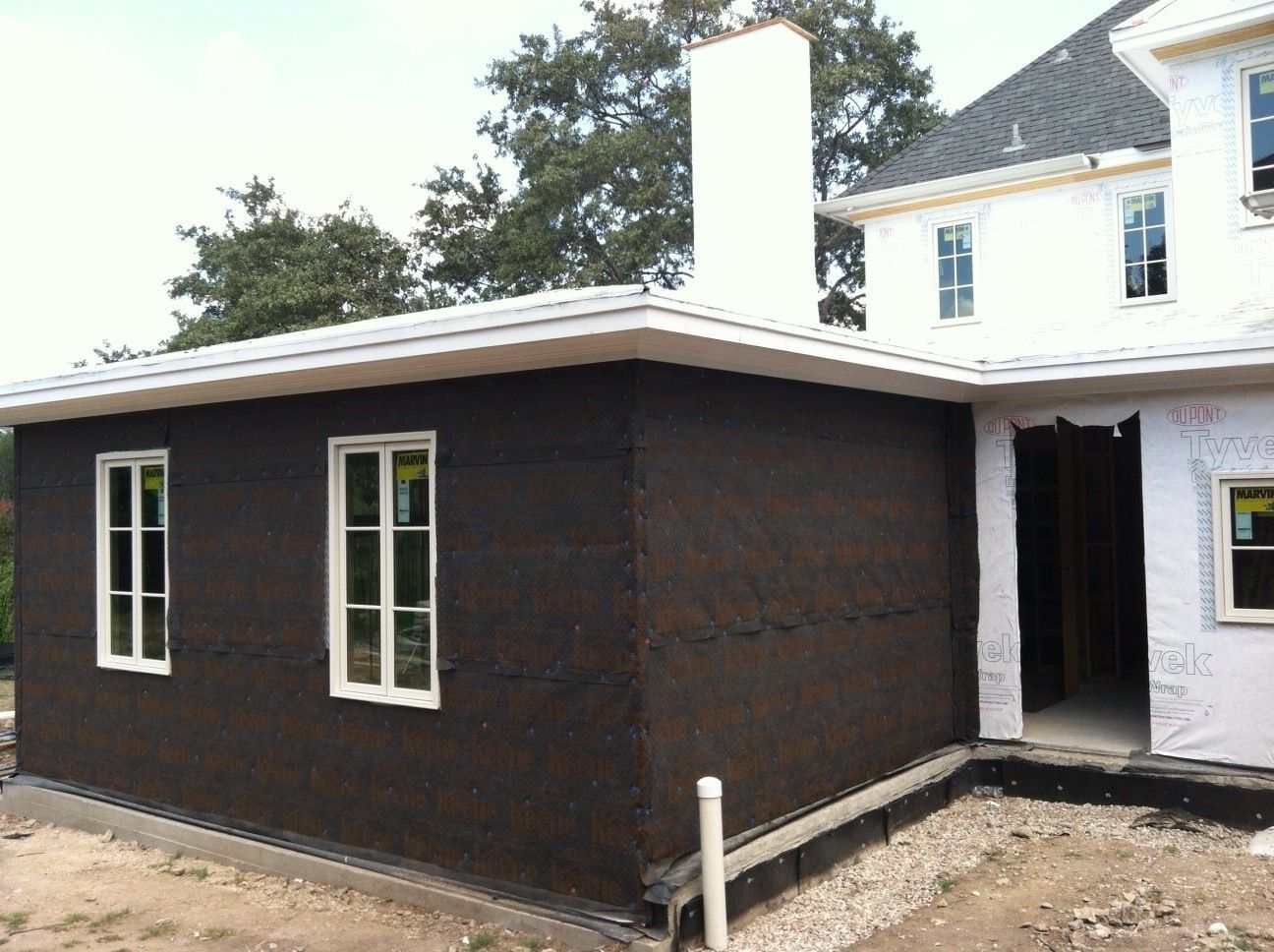 Keene Driwall laid directly over the fully detailed Tyvek weather barrier.