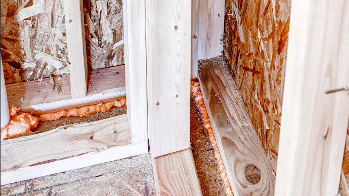 An advanced corner, with two studs instead of three, leaves more room for insulation even as it saves on lumber. Spray foam was used to air-seal around windows, behind outlets, at bottom plates, and at any holes for wiring or plumbing. Ladder blocking was used at interior/exterior wall intersections.