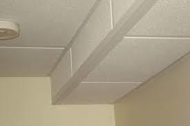 dropped ceiling track and panels allow access to mechanical components