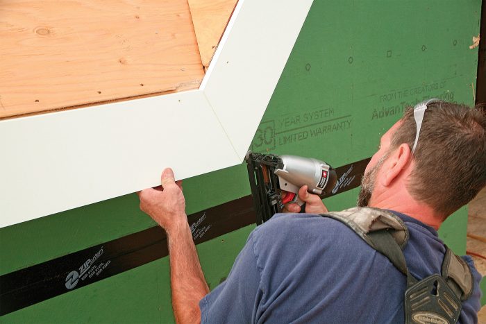 One nail helps. After finding the correct angle, cut and glue the fascia pieces, making sure they stay even with the plane of the roof sheathing. A 16-ga. nail provides insurance.