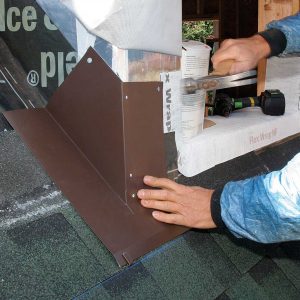 Nail the corner. Use nails that are galvanically compatible with the flashing: aluminum or hot-dipped galvanized with aluminum, copper with copper, stainless steel with stainless steel, and galvanized with galvanized.