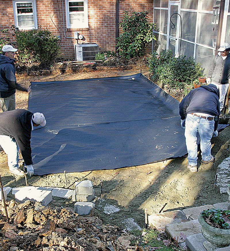 installing geotextile fabric over soft soil