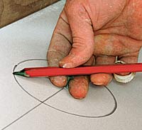 Using a pencil and a drywall nail as a compass