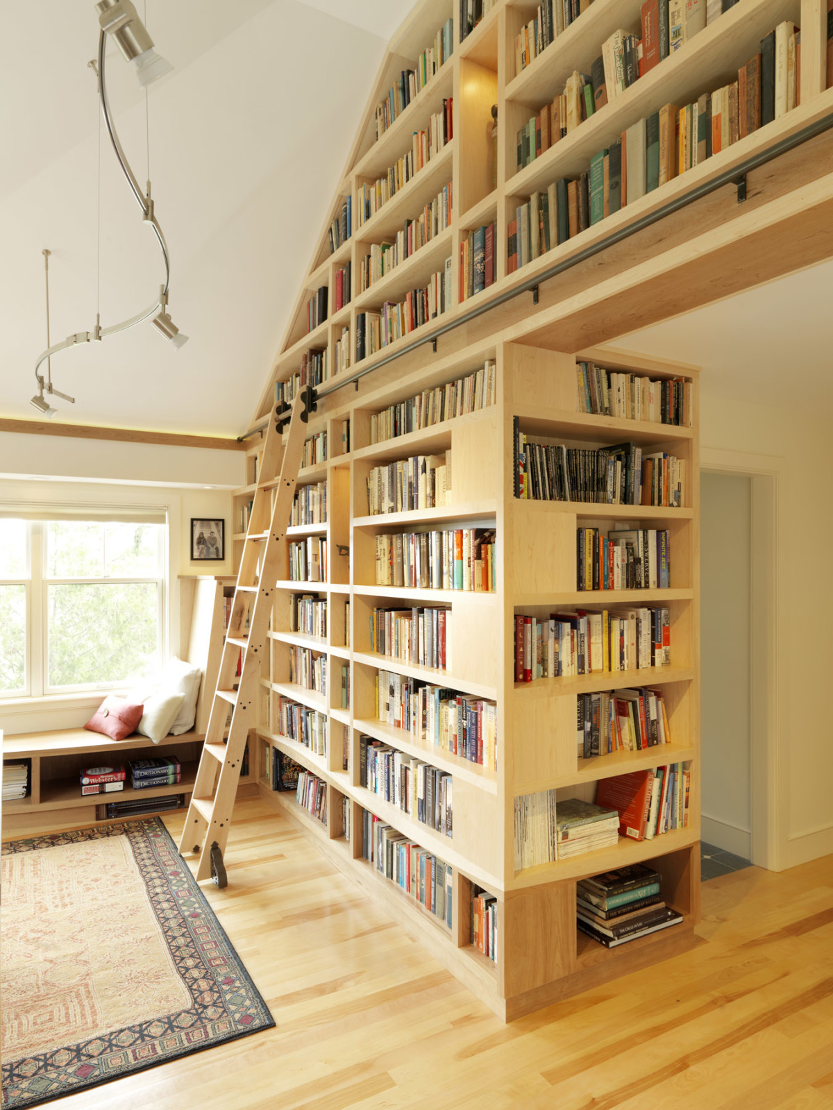 The store features floor to ceiling windows, leather shelves, wood ceilings  and a unique design …