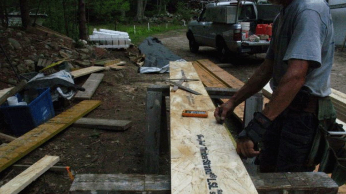 person building stair stringers
