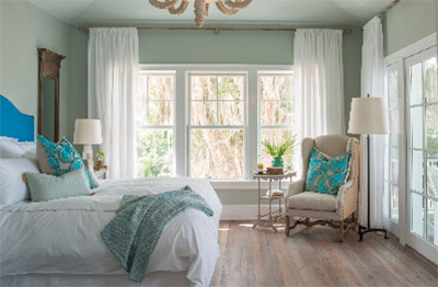 Falling asleep to the rustling trees and crashing waves is made possible by Integrity’s windows and doors. The large picturesque windows and sliding door flood the bedroom with calming morning light and a salty sea breeze for a peaceful indoor retreat.
