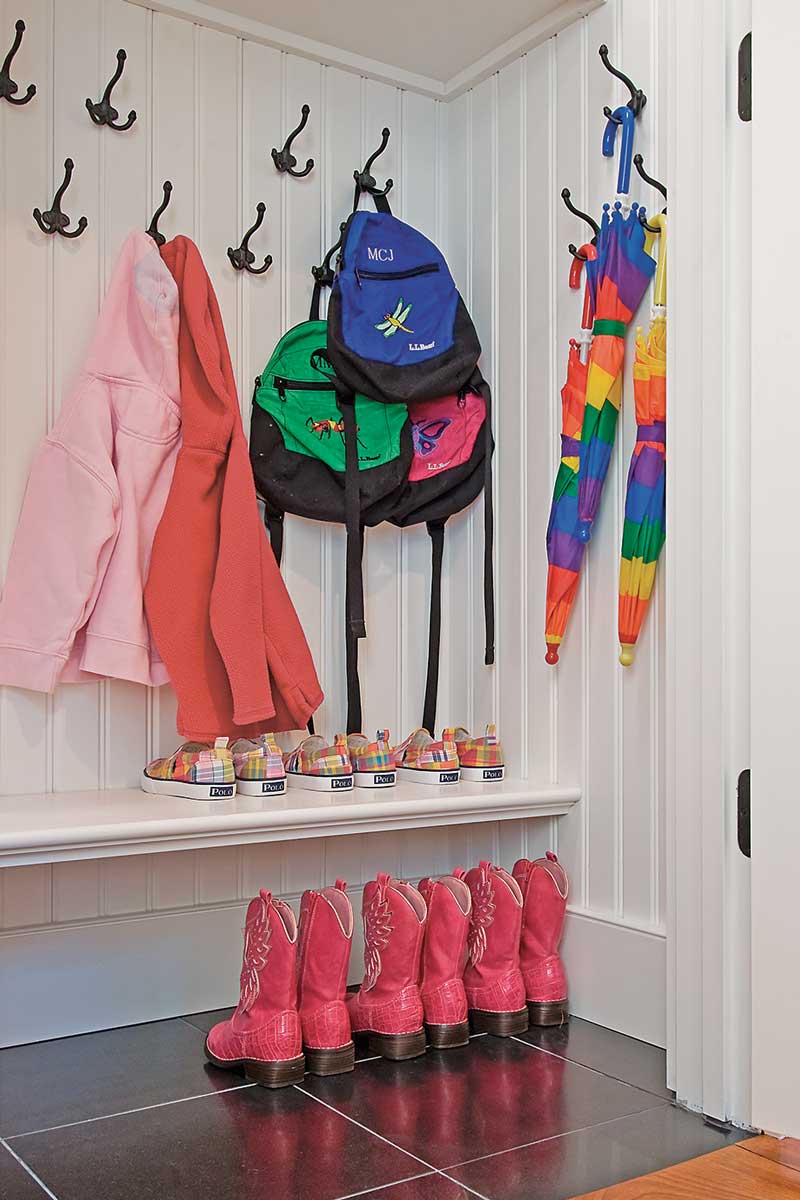 mudroom with hooks for coats and room for boots