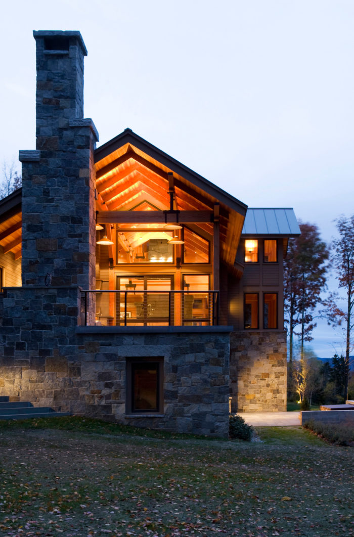 Not to be outdone by the view, the massive stone fireplace brings the modern construction down to earth.
