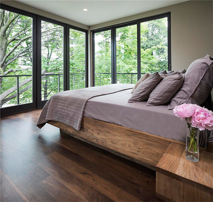 There’s no extra ornamentation needed in this modern, moody bedroom.