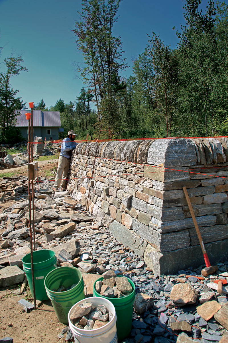 Rock retaining walls pit friction against gravity