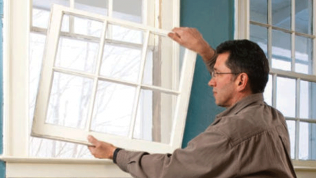 person installing a window