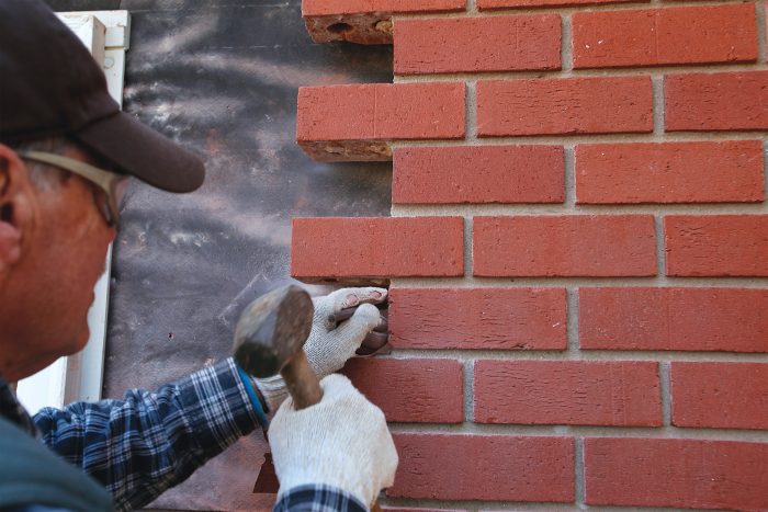 chisel where necessary, tapping lightly to protect the brick veneer