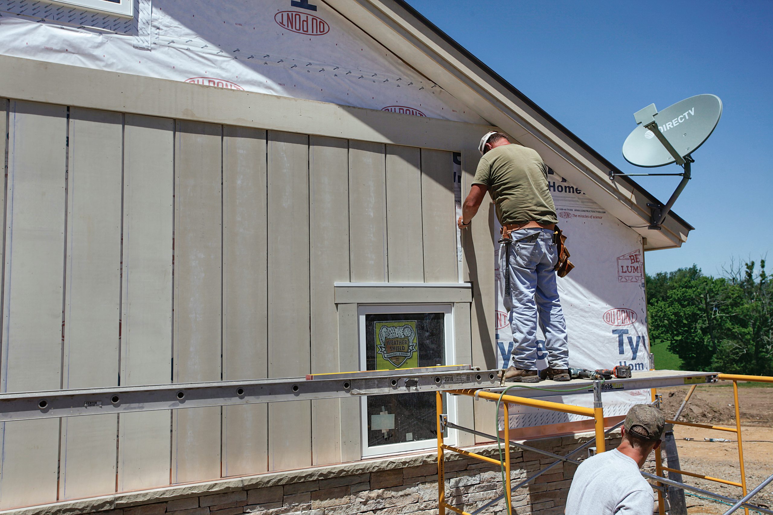 fit the board and batten siding snugly around window and door trim