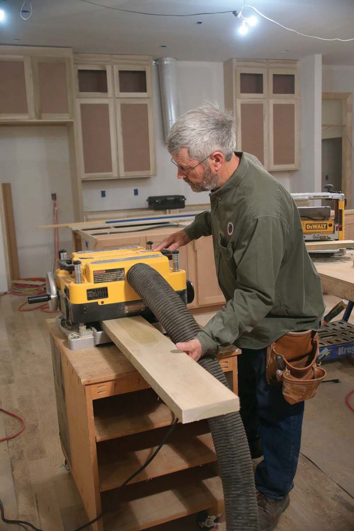 Run all of the rough-cut stiles and rails through the planer, taking 1⁄16 in. off of each face.