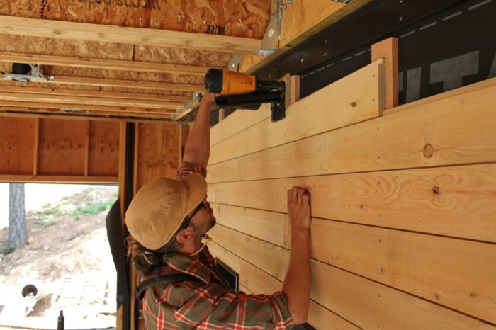 siding being nailed in