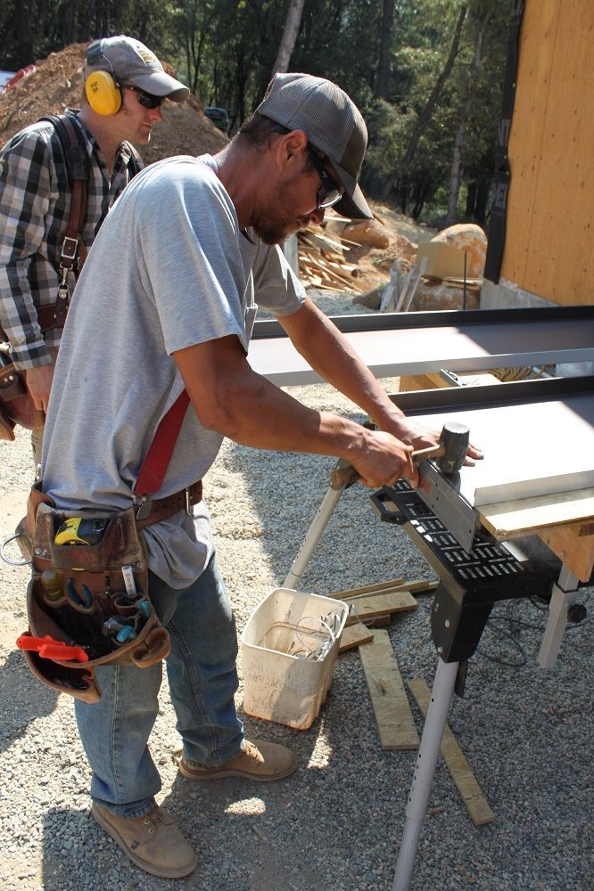 image of tools for bending metal roofing