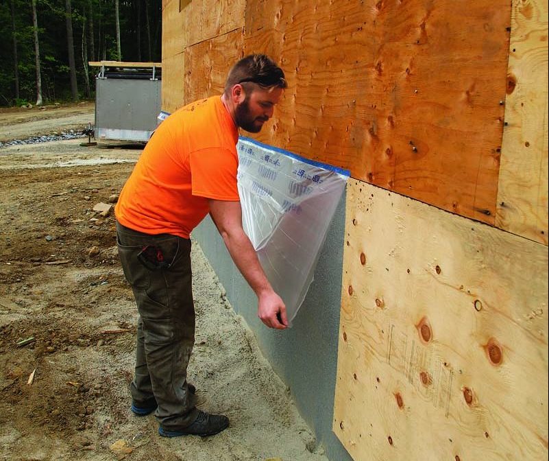 area covered with painter’s tape and plastic sheeting