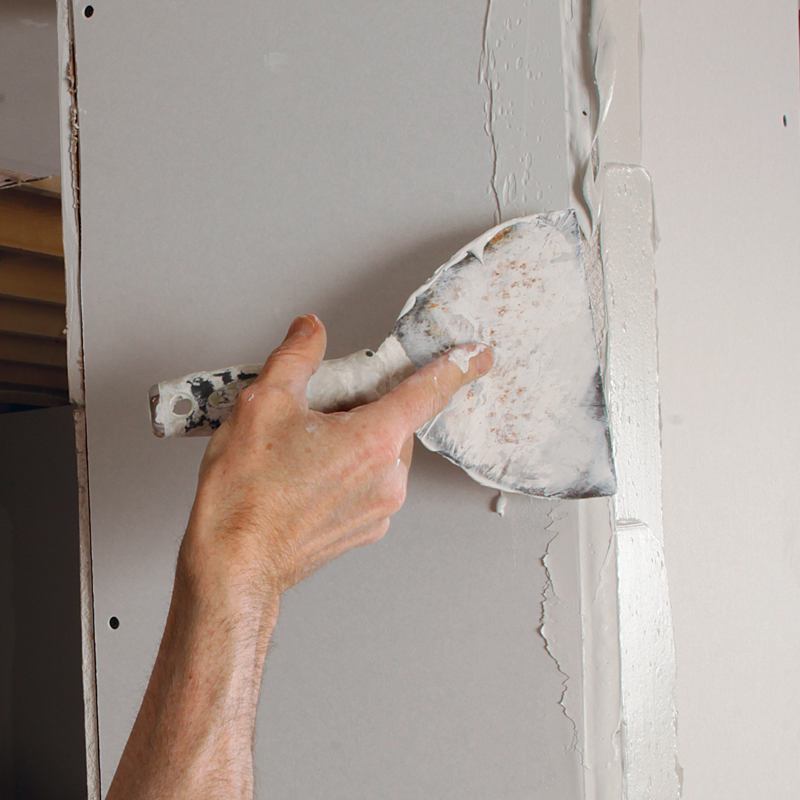 Mud both sides. Use a 4-in. to 6-in. taping knife to apply an even coat of joint compound to both sides of the corner.