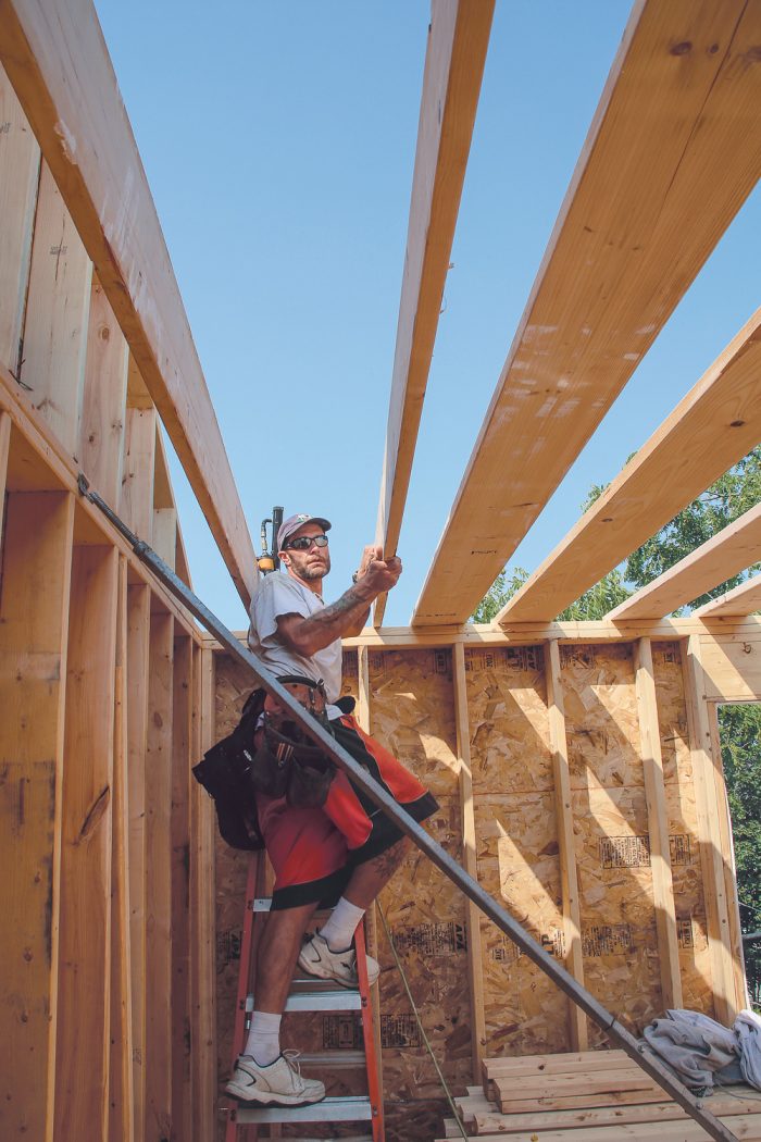 Getting joists on as quickly as possible is the best way to ensure that the walls are held straight and plumb and are less likely to be knocked or pushed out of alignment. It also means you can take down the braces, which get in the way of building nonbearing partitions.