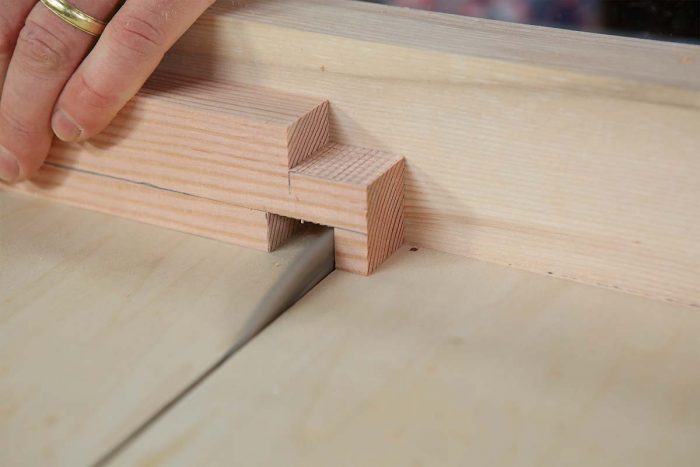 Speed tenons. With a crosscut sled and zero-clearance cutline, take successive passes to remove a little wood at a time.