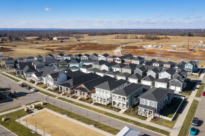 neighborhood streets in a New Urbanism community with sidewalks, front porches, and alley-loaded garages