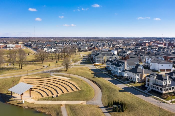 New Urbanism open space and public park with amphitheater and pond 