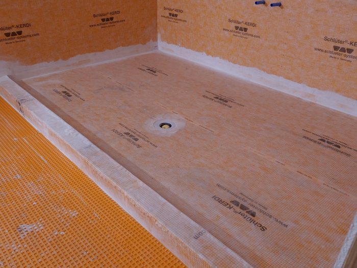 The wide Kerdi roll allows the shower base to be waterproofed with a single piece.