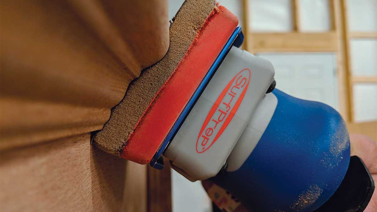 The SurfPrep sander’s foambacked sandpaper allows it to conform to moldings and other complex profiles.