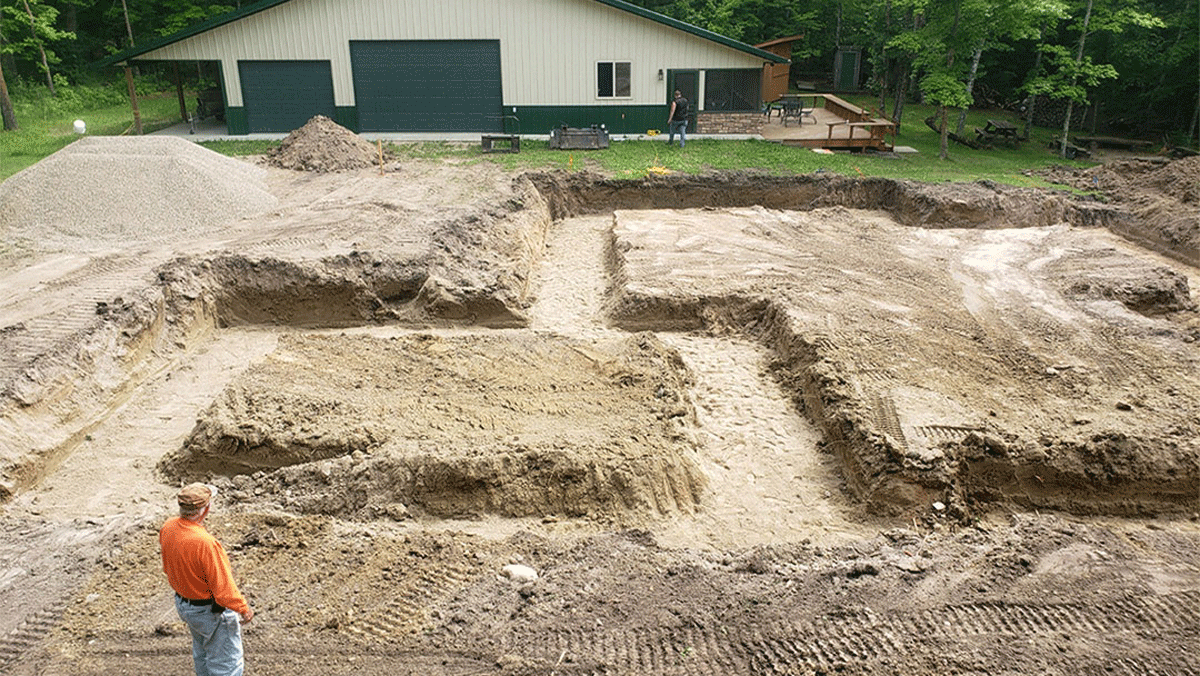 Person stands where the foundation of a house will be 