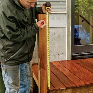 1. Measure up from the finished deck to the underside of the railing cap.